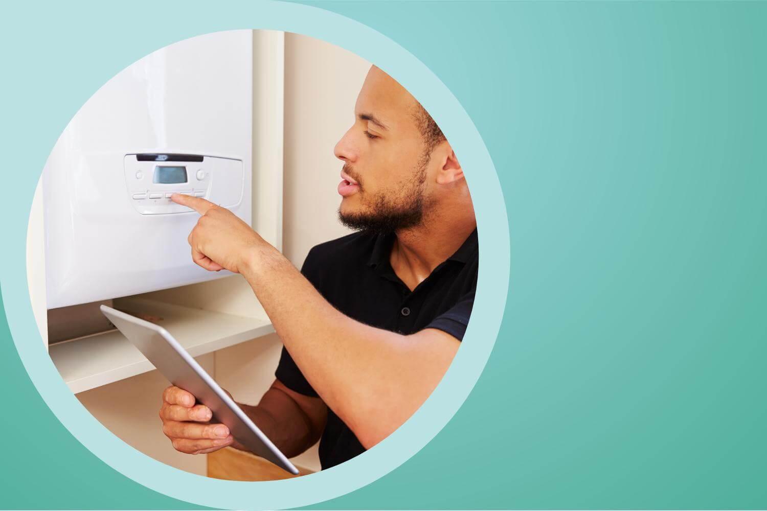 A man with a trimmed beard makes adjustments to a boiler. He has the instructions in his hand.