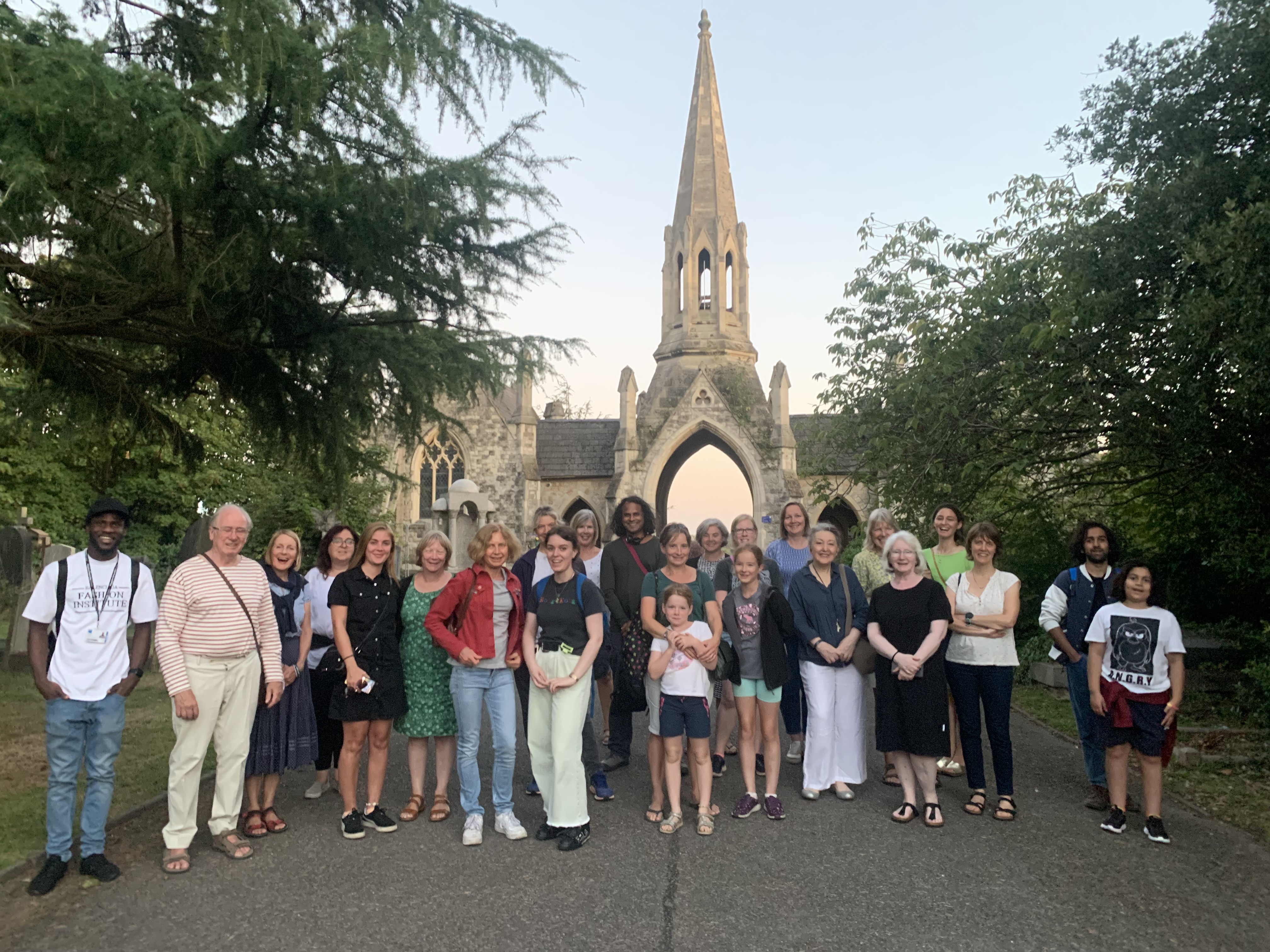 A group of people stood in front of a church before a volunteering event