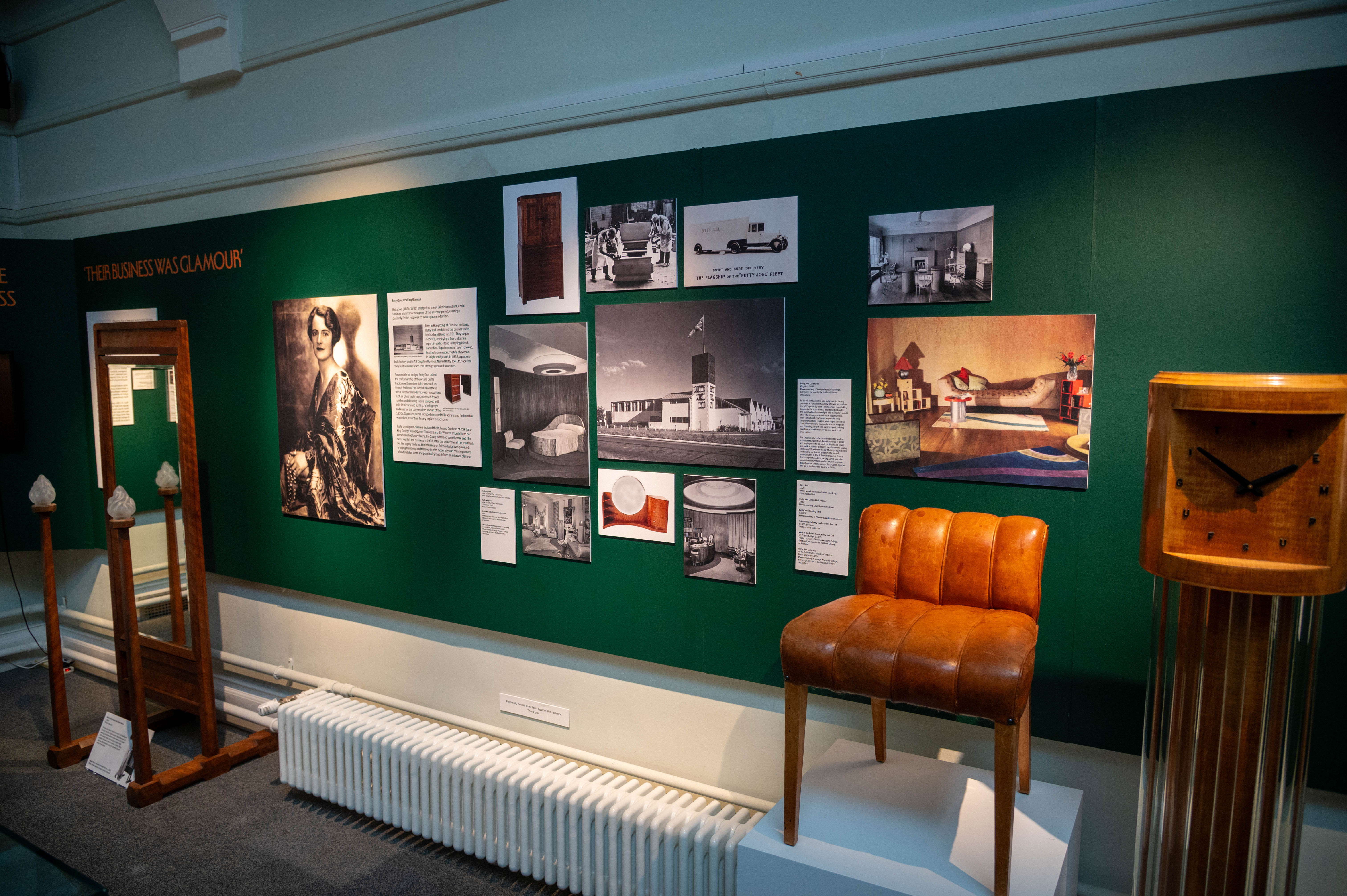 Kingston glamour exhibition with objects and images. Eye catching photos include a black and white factory phtograph and noticeable objects an art deco chair and clock