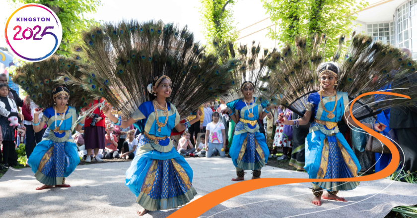 An outdoor performance in Kingston,There is is a group of  brightly costumed dancers with big peacock feather fans. It looks like a celebration.
