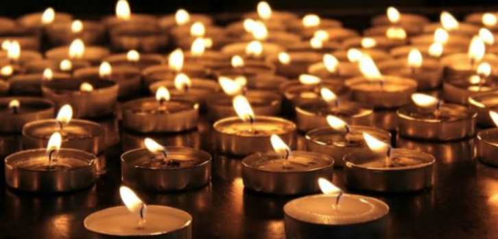 An image of candles lit for Holocaust memorial day