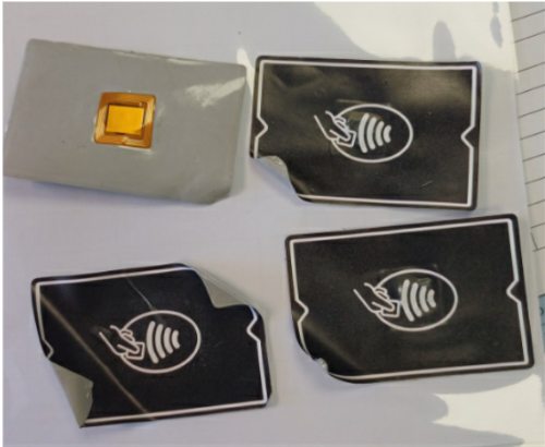 Three black stickers with contactless payment icon